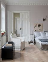 IKEA Karlstad armchair with a Bemz cover in Loose Fit Soft White Rosendal. Bemz bedskirt in Sage Brown Rosendal Linen. 