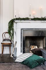 Living Room, Standard Layout Fireplace, Wood Burning Fireplace, Chair, and Dark Hardwood Floor Bemz cushion covers in linen Brera Lino Noir, velvet Zaragoza cushions in Viridian and Espresso, Grapite Grey Vreten Pinstripe.  Photo 7 of 10 in These 5 Interior Design Trends Will Reign Supreme in 2018 from Seasons greetings