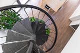 A brand new and beautiful spiral staircase join the two levels in this office.
