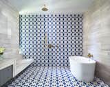 Master bathroom 'wet room'. Materials are encaustic concrete tile, limestone tile.
