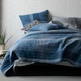 Midnight Quilt: The coziness of this quilt will make you want to quit your day job. Cuddle up under the blissful blues of the Midnight Quilt—bold stripes overlap classic plaid for tasteful texture. Sewn of yarn-dyed cotton for lasting color and quilted by hand. 