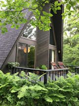 This flat top A-frame cabin is surrounded by 13 acres of natural forest on all sides, a river just a few steps from the door and is completely private.