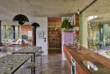 The Kitchen is built from solid Rosewood, featuring smeg appliances and island benches built by Jesse Bennett. The butlers pantry conceals an appliance bench and further storage.