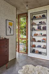 The closet inside the master wing features wallpaper by Erica Wakerly and original danish furniture.