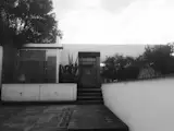 the main entrance of the house and the garage area