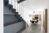 The ground floor features a grey resin flooring referring to the industrial past of the building;