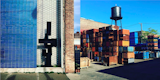 Left: Blue tiled wall, north of the city on Broadway with Brutalist sculpture, Right: Shipping yards