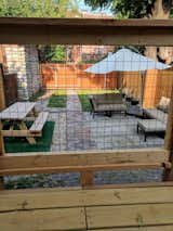 Outdoor, Vertical Fences, Wall, Wood Patio, Porch, Deck, Walkways, Small Patio, Porch, Deck, Hardscapes, Back Yard, Wood Fences, Wall, and Pavers Patio, Porch, Deck Backyard looking from the deck  Photo 9 of 15 in 19th Century Townhome by James O'Mara