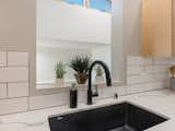 Kitchen, Quartzite Counter, Ceramic Tile Backsplashe, Ceiling Lighting, Subway Tile Backsplashe, Undermount Sink, and Wood Cabinet  Photo 13 of 37 in One Of A Kind Santa Fe Modern Home by Austin