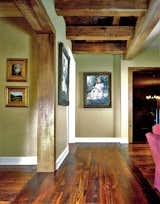Rustic, hand-hewn beams create a rustic yet contemporary vibe in this home.   Photo 9 of 12 in Beams, Doors, Shutters & More by Albany Woodworks