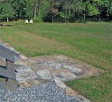 The orthogonal edges of this crushed rock and locally quarried, broken stone path add a contemporary simplicity to this garden in rural West Virginia.  