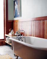 Display an assortment of bath accoutrement near the tub for guests to indulge.