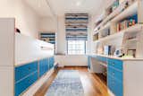 Storage bed and desk in white and blue lacquered plywood