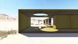 The desert loft resident is involved in off-road activities and required a place, which would sustain its appearance through sandstorms and extensive heat. The massive metal structure elegantly sits in the harsh environment.
 The entrance door, secluded behind the thick metal screen, leads to the largest area of the house, unifying the kitchen, the dining room and the living room. The hall connects to three bedrooms and the bathroom.
 The dining room exits to the terrace with the fireplace, carved in the floor. the ceiling is hollowed out right above it, following the lines of the round cut out in the floor. The gap's presence is almost poetic, as if it's the only passage transferring the smoke to the sky.
