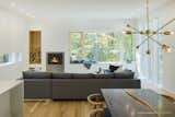 Wood Burning Fireplace, Sofa, Recessed Lighting, Light Hardwood Floor, Chair, Table, and Living Room  Photo 3 of 10 in TinkerBox by Studio MM Architect