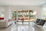 Living Room, Ceiling Lighting, Coffee Tables, Bench, Sofa, Desk, Concrete Floor, Recessed Lighting, and Chair  Photo 5 of 18 in Hyde Park House by Studio MM Architect