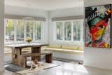 Dining Room, Bench, Pendant Lighting, Storage, Accent Lighting, Concrete Floor, Table, and Ceiling Lighting  Photo 14 of 18 in Hyde Park House by Studio MM Architect