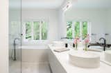 Bath Room, Marble Counter, Porcelain Tile Floor, Open Shower, Wall Lighting, Freestanding Tub, and Vessel Sink  Photo 9 of 18 in Hyde Park House by Studio MM Architect