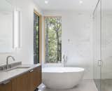 Bath Room, Marble Wall, Corner Shower, Undermount Sink, Concrete Floor, Enclosed Shower, Freestanding Tub, Ceiling Lighting, Recessed Lighting, and Ceramic Tile Wall  Photo 14 of 28 in Cat Hill by Studio MM Architect