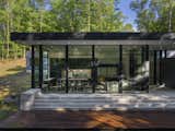 Outdoor, Small Patio, Porch, Deck, Boulders, Concrete Fences, Wall, Concrete Patio, Porch, Deck, Grass, Woodland, Retaining Fences, Wall, Trees, Back Yard, Wood Patio, Porch, Deck, and Slope  Photo 18 of 19 in South Mountain House by Studio MM Architect