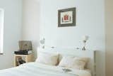 Bedroom, Bed, Lamps, Wardrobe, Ceiling Lighting, Accent Lighting, and Laminate Floor  Photo 9 of 13 in Cozy in the Big City by Hajnalka Ilyes