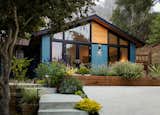 Cedar soffit, painted siding, custom windows 