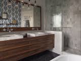 Walnut bathroom vanity and marble tiles