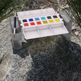 The Portable Painter excels on uneven surfaces. Paints are not included