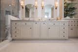 Master bath cabinetry makes a statement with the symmetry and custom hand-beaded inset doors. 