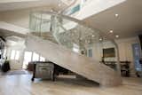 The side view shows how beautifully the custom woodworking was bent to accomplish the overall curved design up the staircase.
