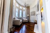 Circular sitting room retreat with floor to ceiling windows with lots of light for reading, relaxing or watching TV.