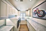Laundry room with extra counter space and storage to service needs of large family spending time at the beach.