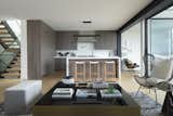 The open kitchen features a clean lines a a neutral color palette.