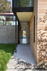 I reduced material palette of Western red cedar, blackened steel, concrete, and glass, marry form and function.