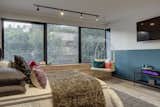 Bedroom with a playful swing and pops of color.