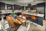 An earthy modern kitchen at Bristol in Chino Hills.   Photo 1 of 8 in 5 Fabulous Kitchens for Hosting Thanksgiving Dinner by SoCal Living