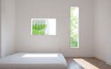 SIMPLE BEDRROM GET NATURE LIGHTING FROM WINDOWS WHICH DESIGN FOR LIMIT HEAT AND LIMIT VIEW FROM NEIGHBORS 