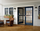 Essence Series fiberglass exterior, wood interior in swing patio door from Milgard. Choose from a wide variety of exterior colors.