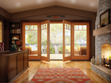 Essence Series in-swing patio doors with sidelights and grids. Warm wood interior, durable fiberglass exterior.