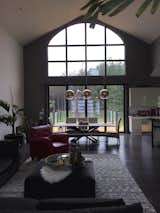 Living room with large 12’ moving glass wall system.  When the doors are open, the great room and patio areas become one large living area.