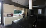 The great room and kitchen has an open modern, rustic, bohemian feel, sleek, elegant and gorgeous Italian kitchen from Italy. High gloss cream lacquered colour.  All wolf appliances.  