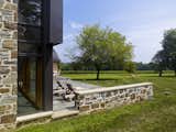 Outdoor, Trees, Back Yard, Field, Hardscapes, Large, Landscape, and Vegetables A new stone patio connects living spaces to the rural site beyond.  Outdoor Large Landscape Field Trees Photos from Elverson Farmhouse Addition