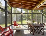 A generous screened porch and open patios extend living spaces to the outdoors.