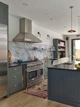  A rich palette of color and natural materials adds warmth and visual drama to the new kitchen.