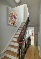 The reconstructed stairway is beautifully day-lit by new casement windows and skylights at the second and third floors.
