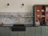  A rich palette of color and natural materials adds warmth and visual drama to the new kitchen.