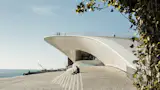 A young woman relaxes in front of the Museum of art , architecture and technology in Lisbon, Portugal.
