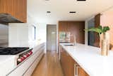The design of the kitchen is unique in that is has no upper cabinets, and features drawers all throughout the bottom cabinetry – a feature not typically found in residential kitchen designs.