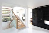 The staircase was relocated to enlarge the entrance foyer and improve the flow of space.