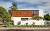 Exterior, House Building Type, Wood Siding Material, Flat RoofLine, and Stucco Siding Material Street facade of home featuring natural Sapele siding and fixed vertical fins  Photo 3 of 13 in 300 Residence by Christian Rice